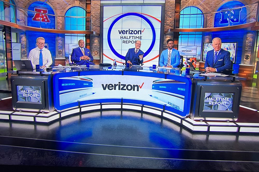 CBS Sports broadcast desk built on curved LED