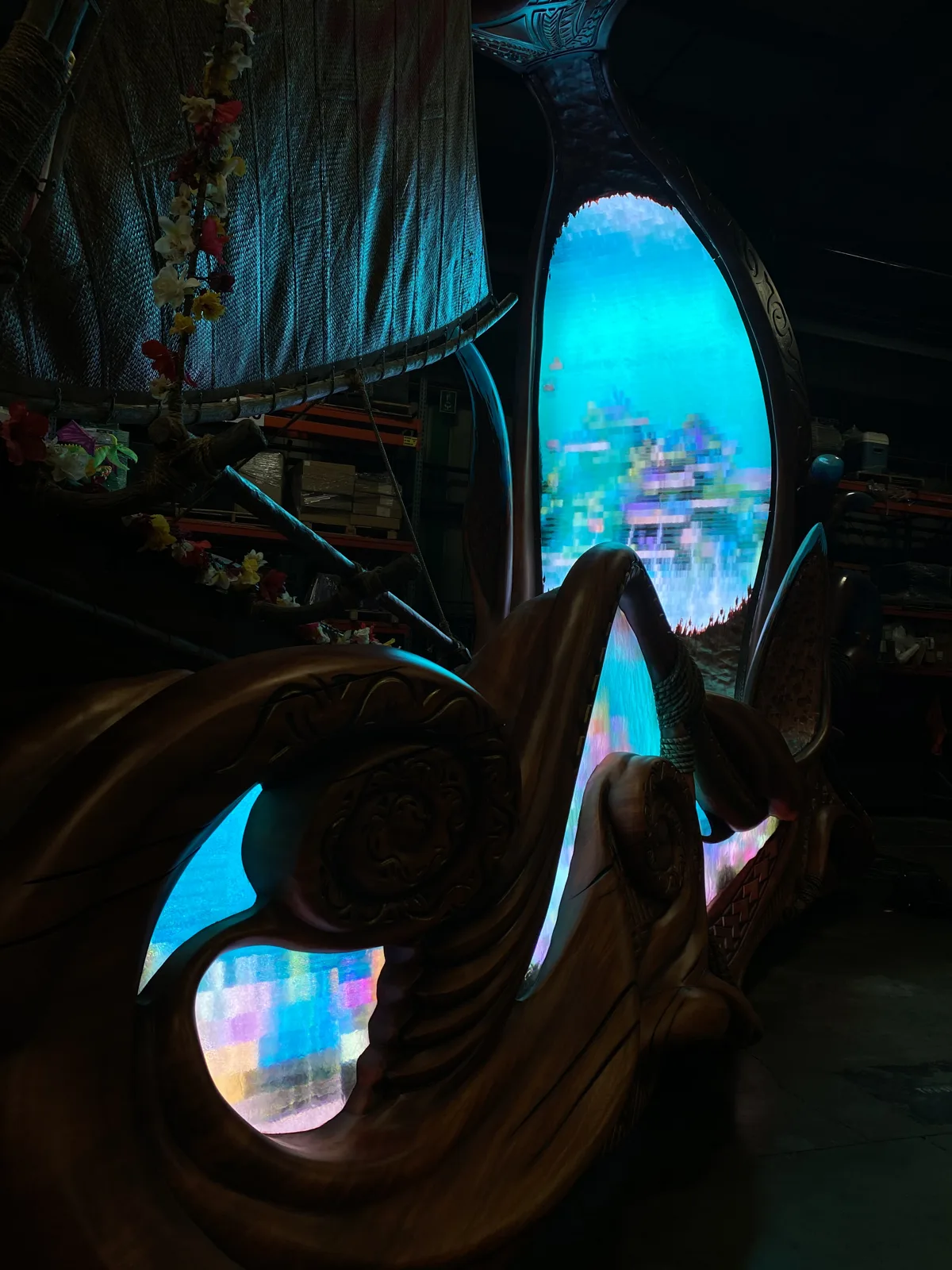Hand-carved Moana float hull with LED inlays at dusk